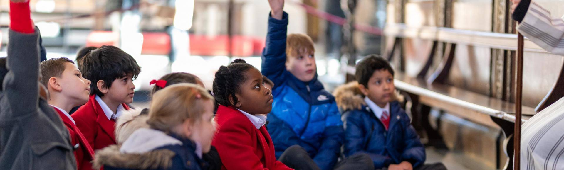 children school hands up engaged