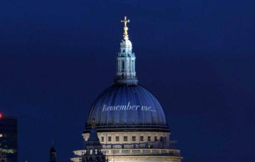 The words Remember Me projected on the white dome of St Paul's at night