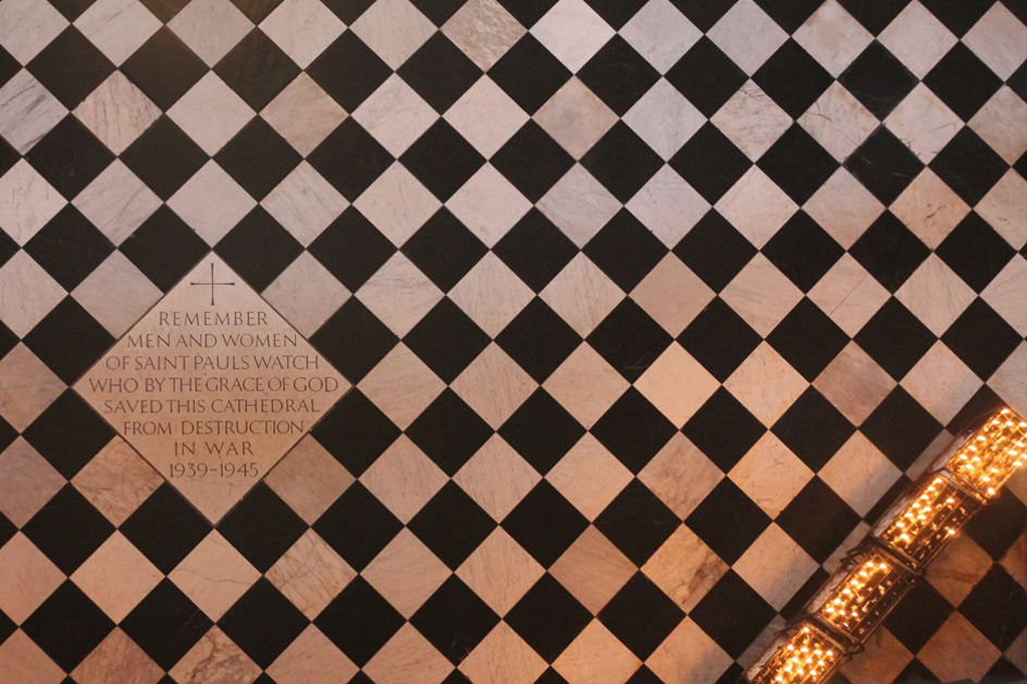 A photo of a tile in the floor of the cathedral dedicated to the St Paul's Watch