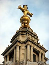 The golden ball and cross on top of the dome of St Paul's Cathedral