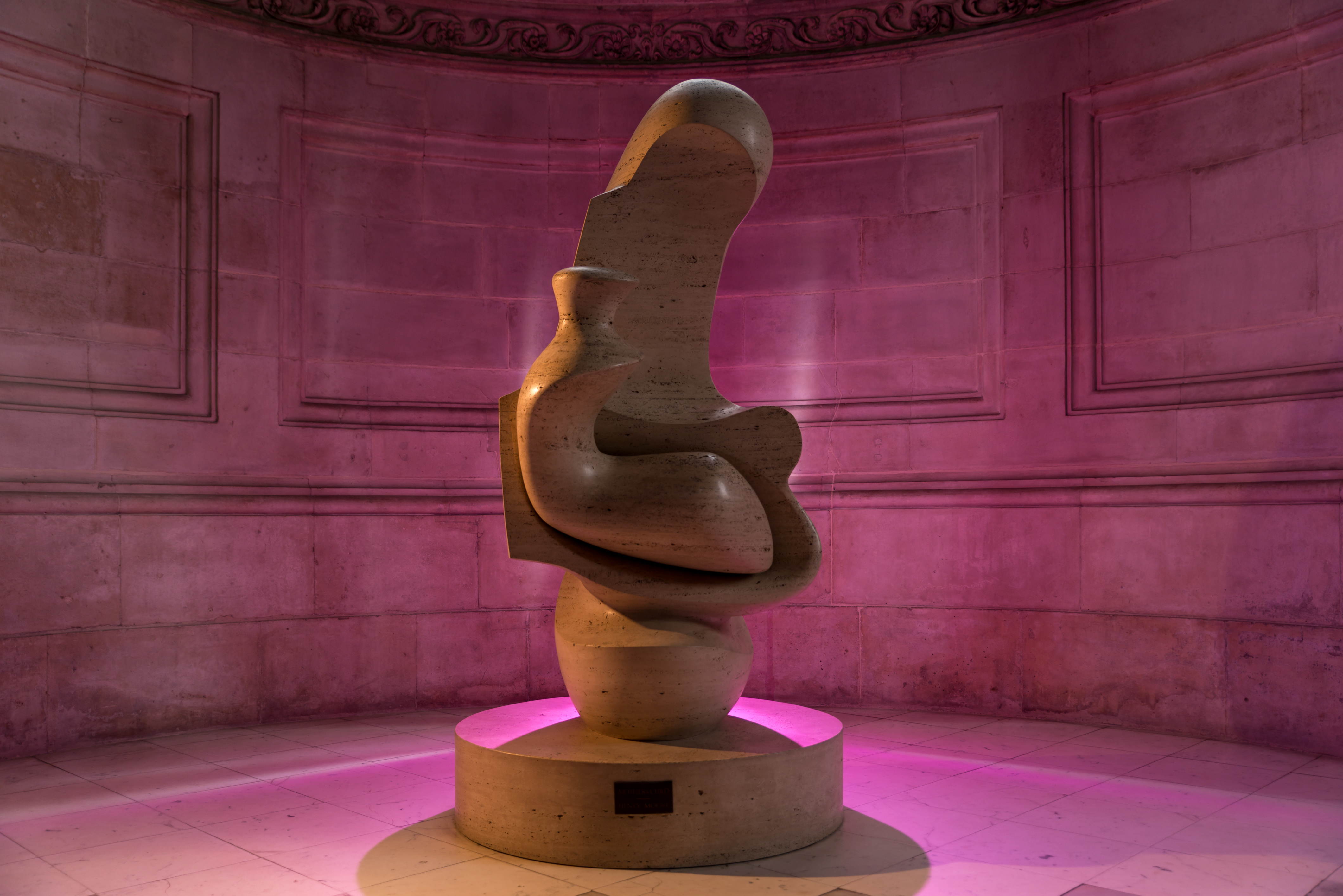 Henry Moore's sculpture bathed in pink light