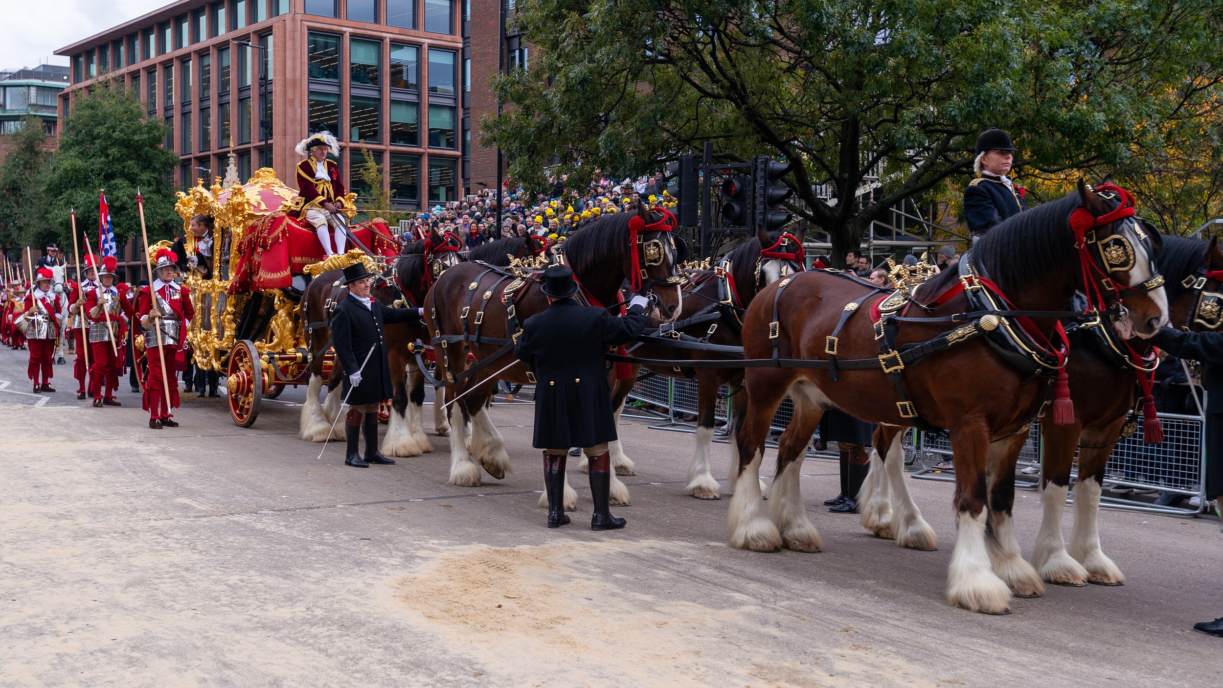 The procession for the Lord Mayor's Show with horses pulling a large golden carriage
