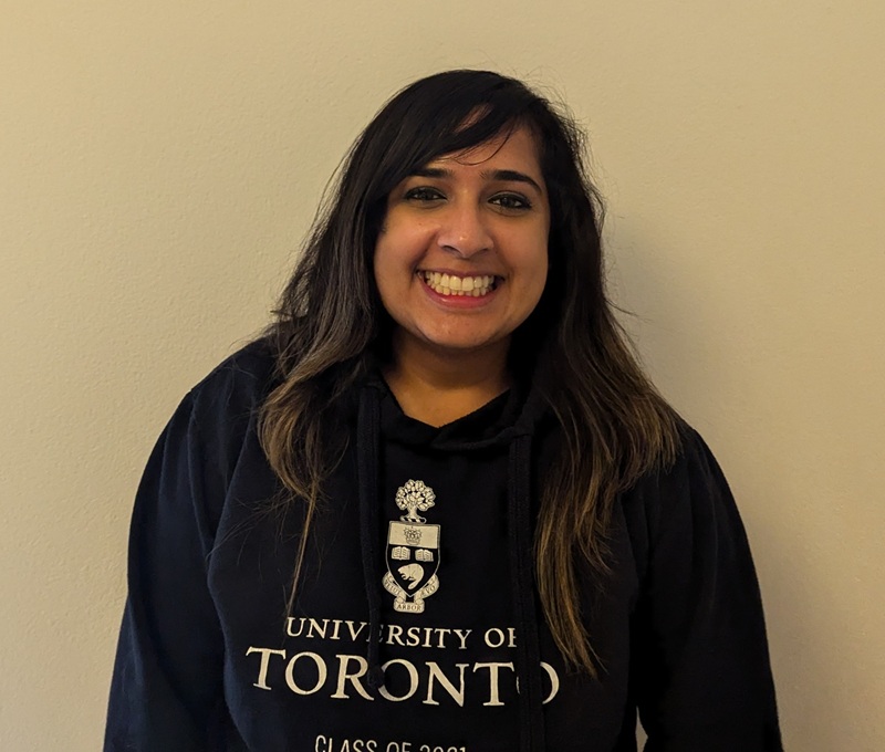 Sarah has long dark hair and wears a University of Toronto sweatshirt