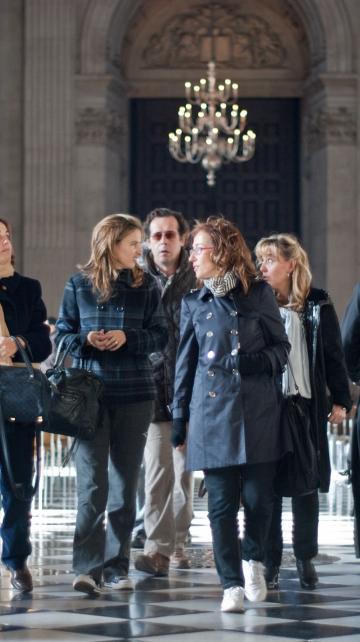 visitors walking the nave women tourists