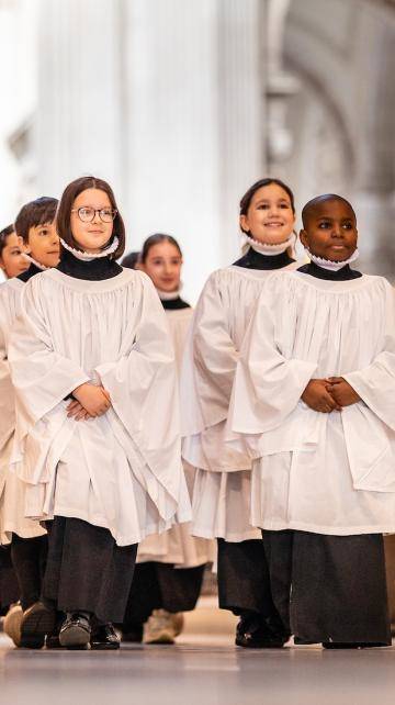boy and girl choristers walking in the quire