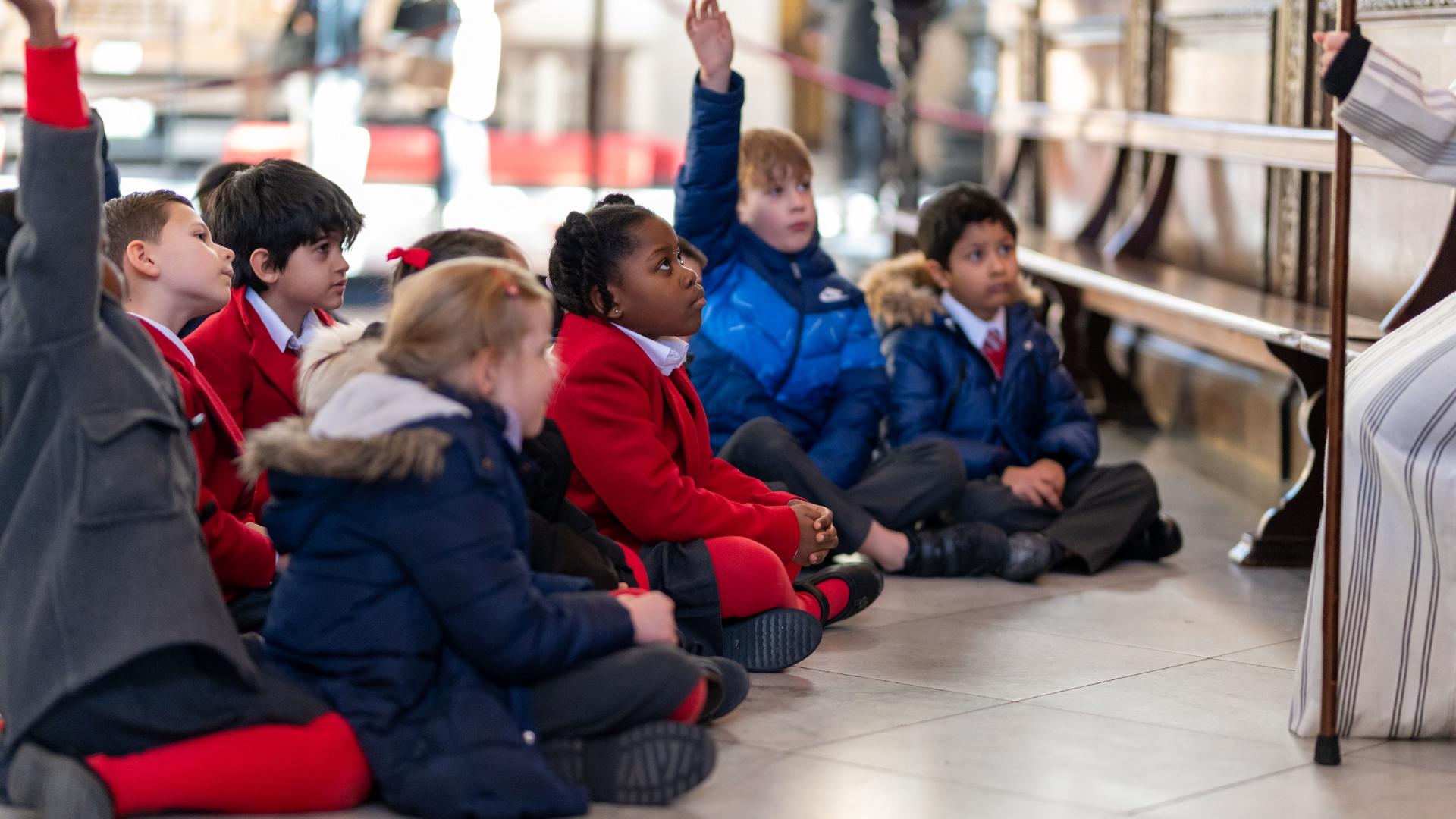 children school hands up engaged