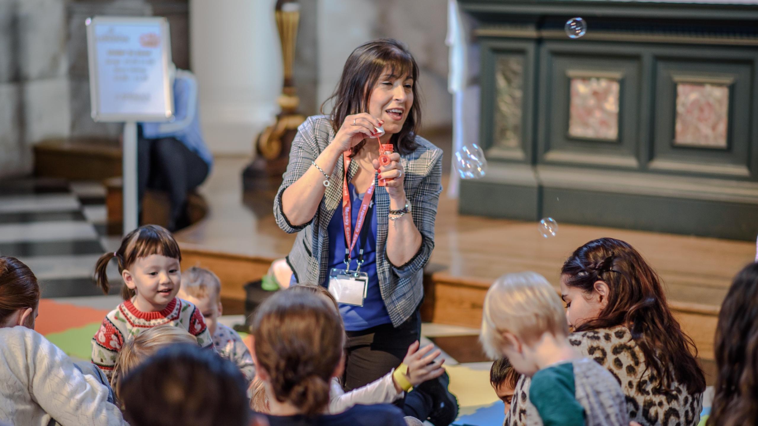 messy cathedral young children blowing bubbles