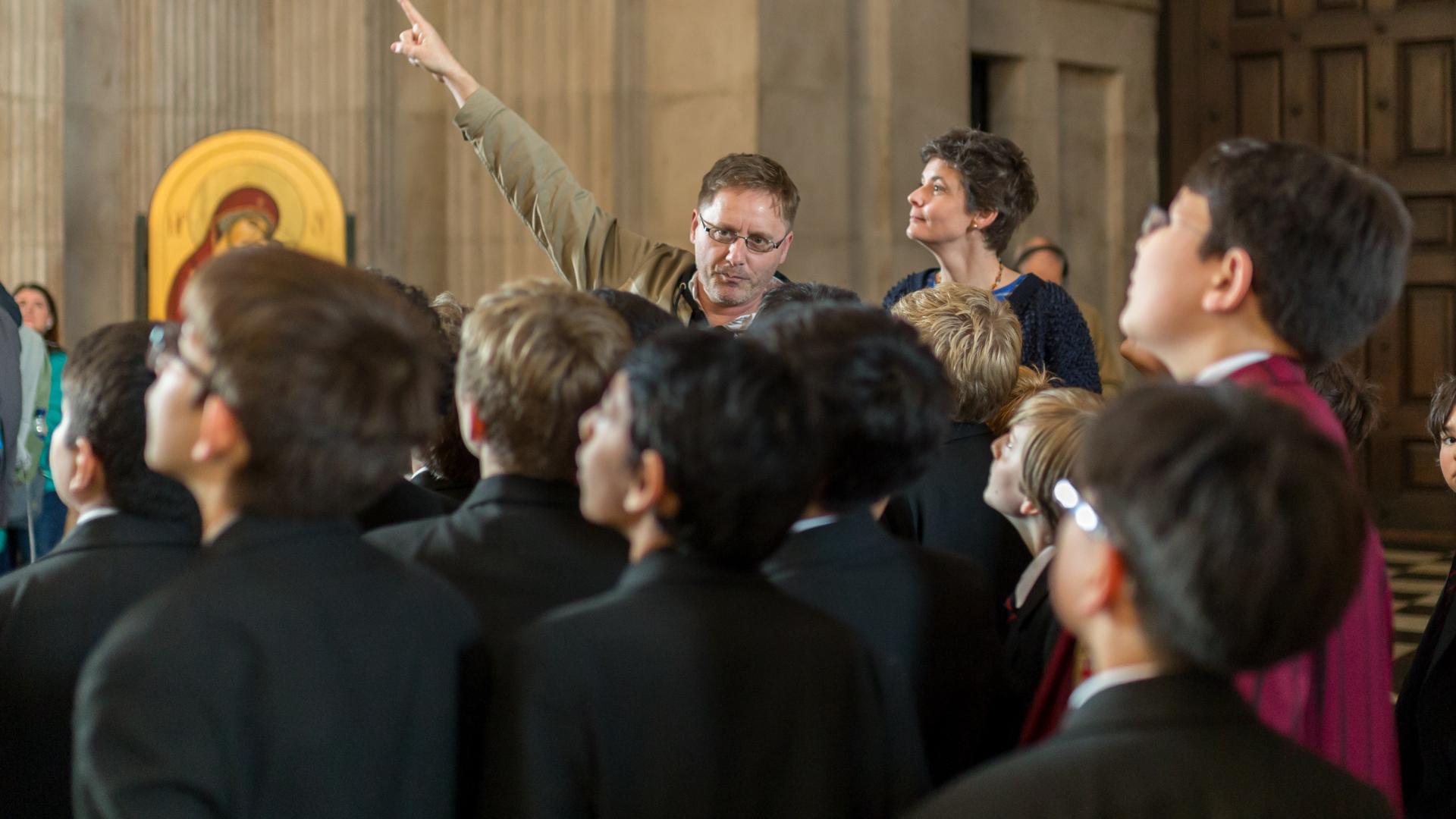 older children pointing class tour listening