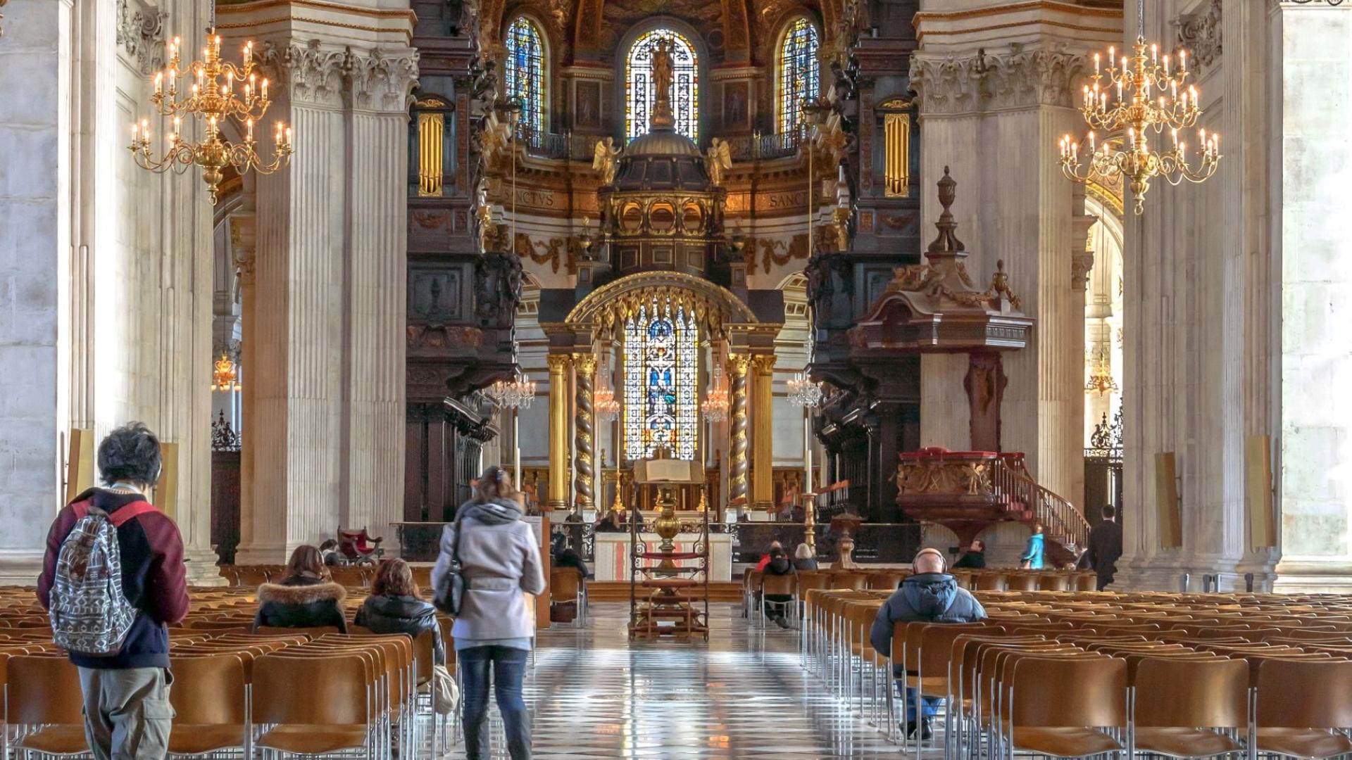 the nave with visitors and bright sunlight