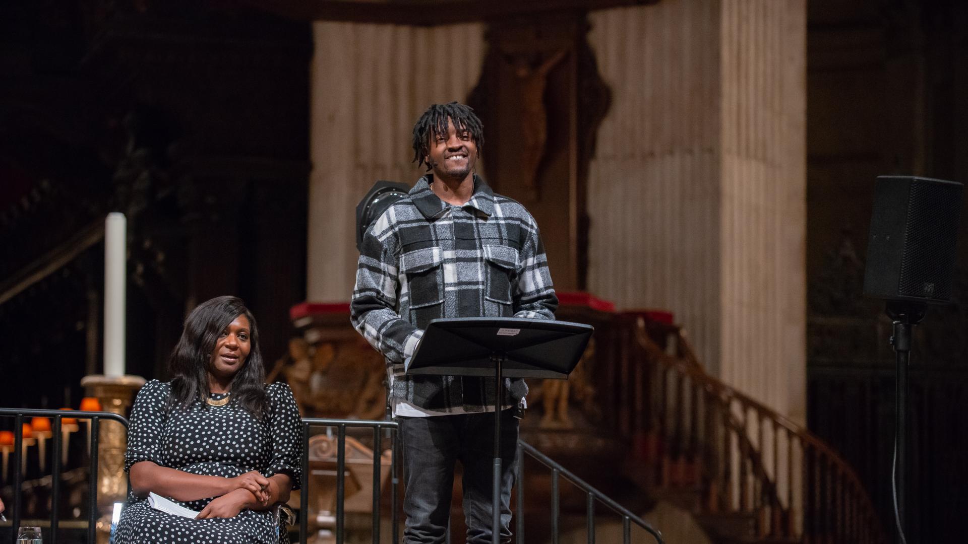 Musician Guvna B speaking at St Paul's Cathedral with Chine McDonald alongside