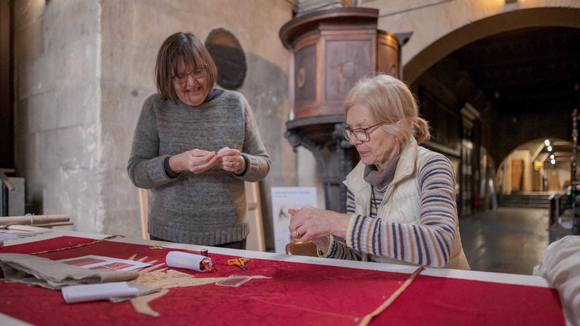volunteer broderers smiling together