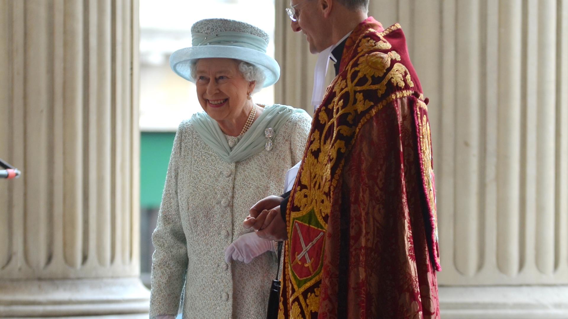 The Dean of St Paul's Cathedral greets Her Majesty the Queen on the steps of St Paul's Cathedral for her Diamond Jubilee service