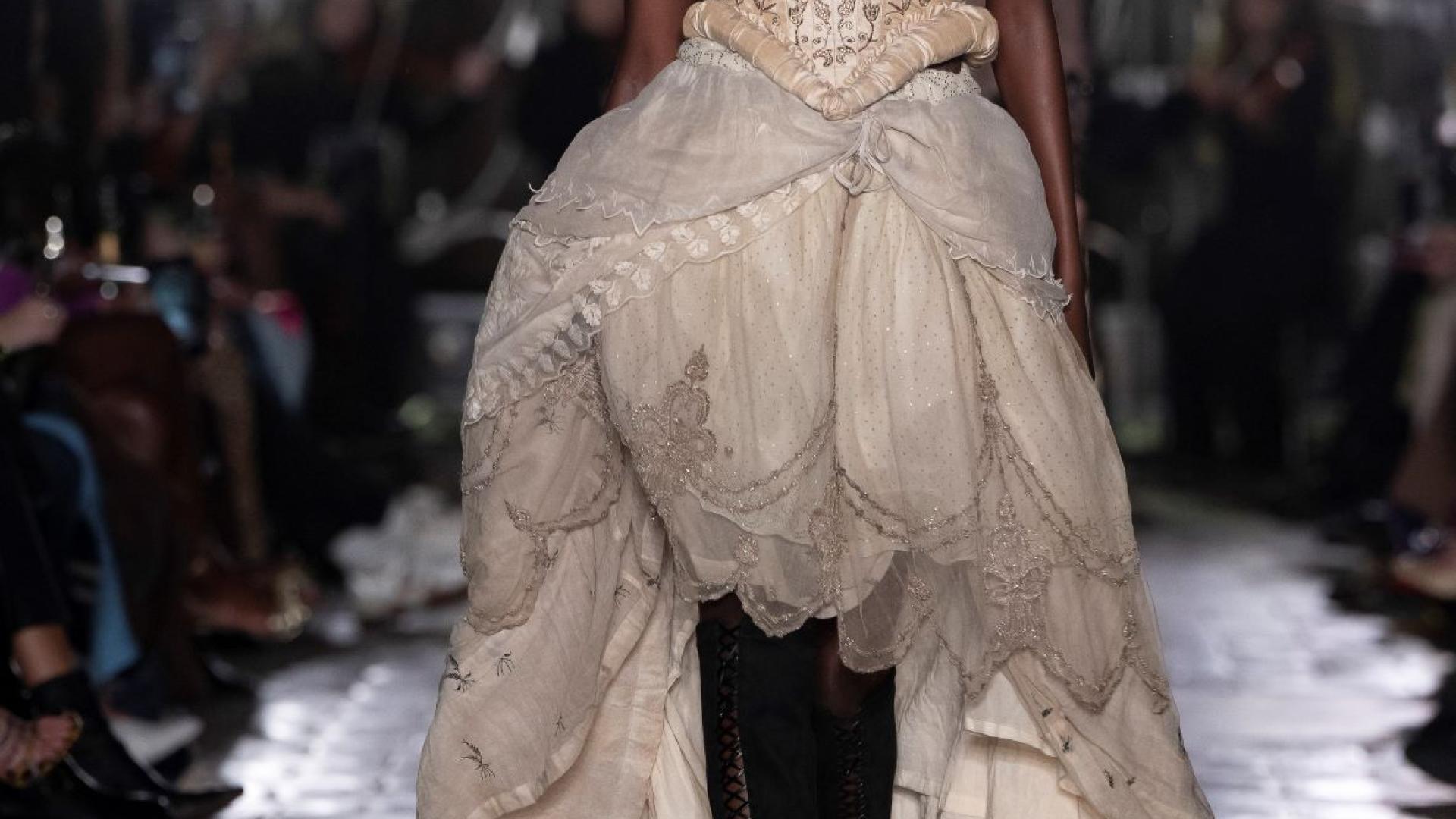 A model walks in a cat walk show in the Crypt