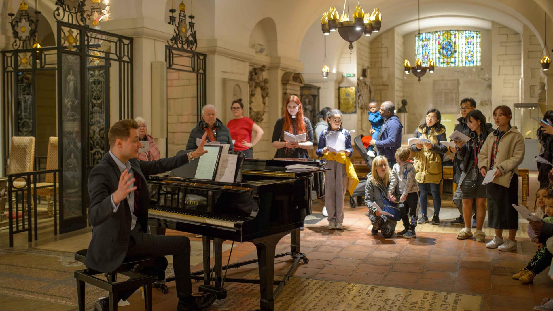 A group singing with a pianist