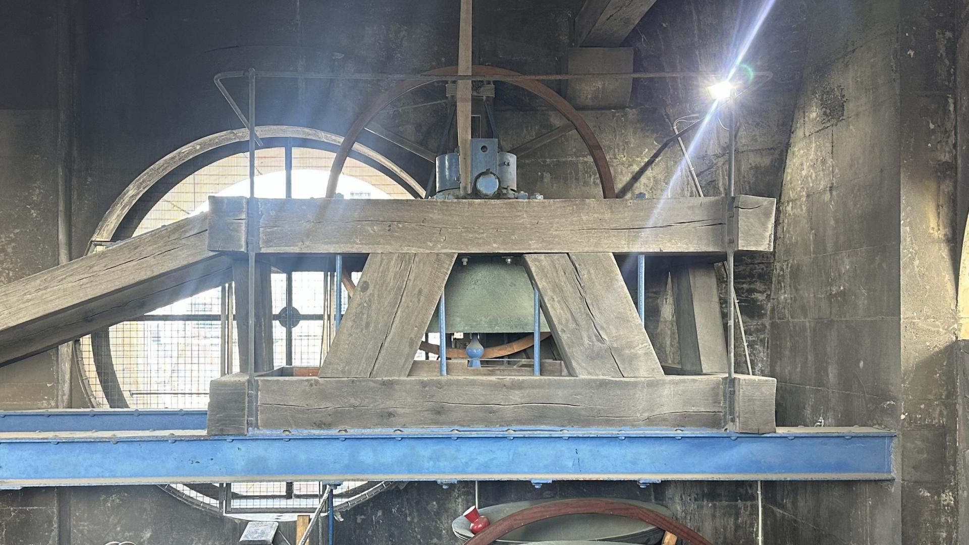 The huge service bell sits in its wooden surrounds in the bell tower