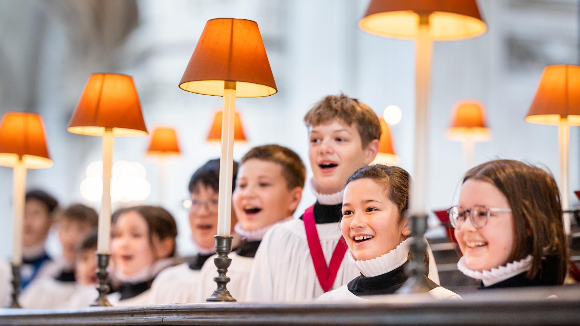 Boy and girl choristers singing in the quire