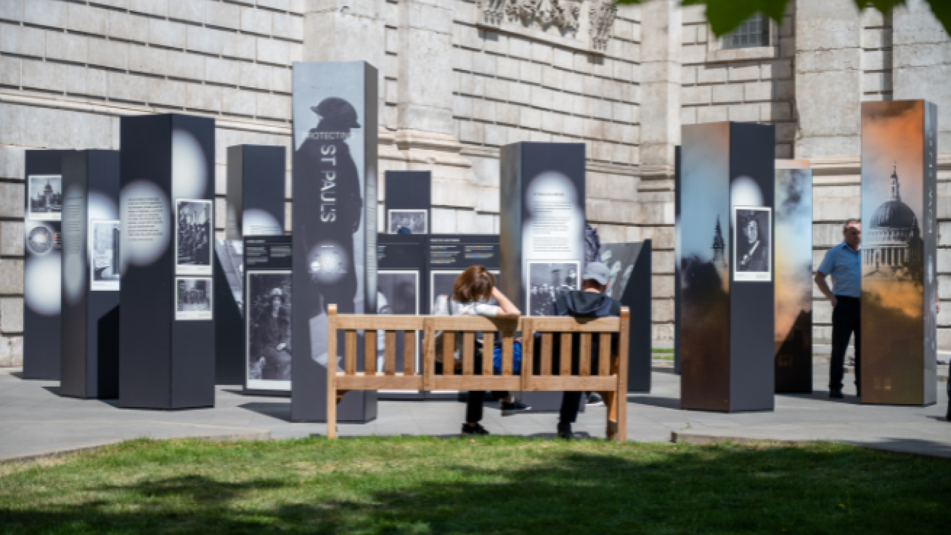 A wide shot of the new exhibition, with a bench in the foreground.