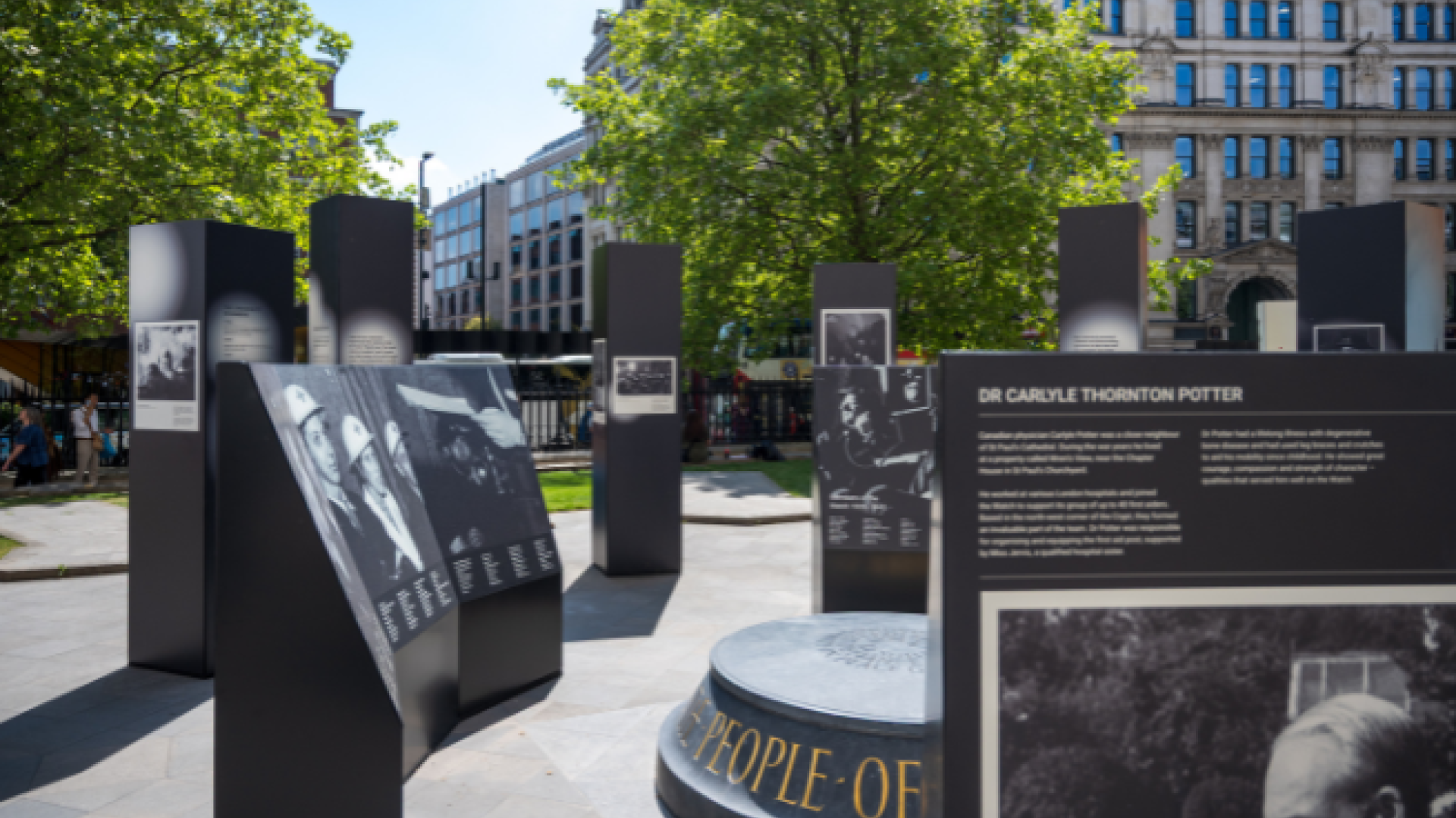 A close up shot of the exhibition, with the war memorial visible in the centre of the exhibition boards.