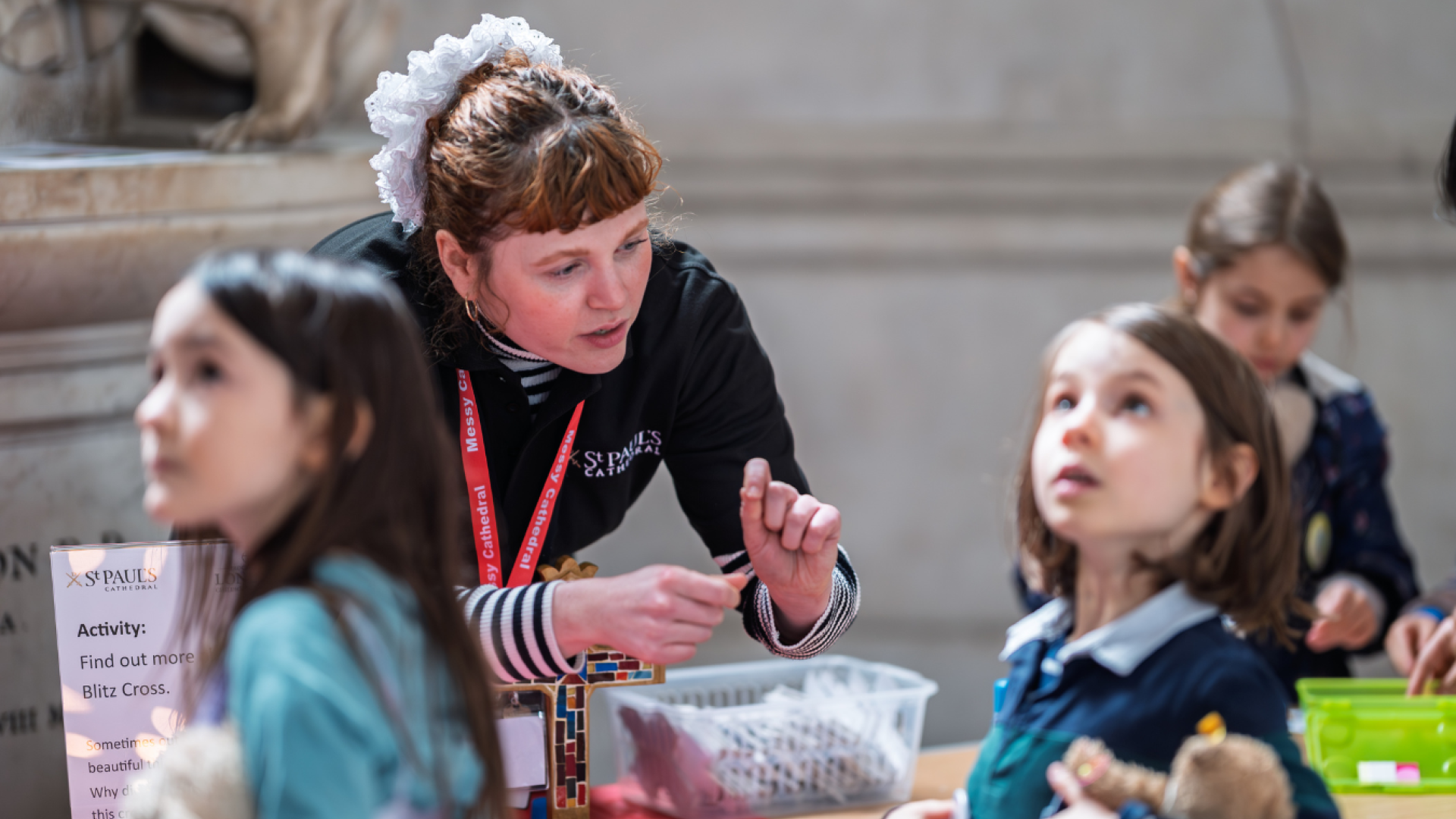 Emily, a member of the Learning team, speaks to children at Messy Cathedral.