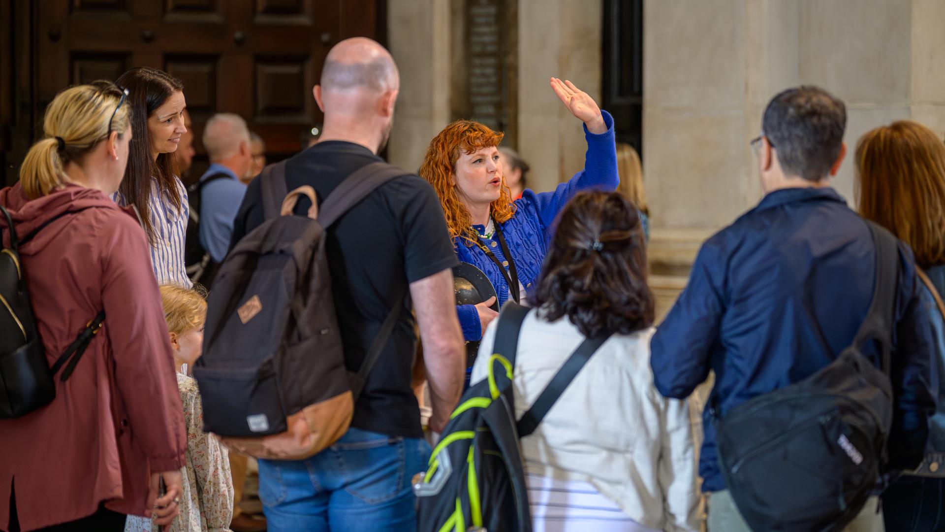 Emily, a member of the Learning team, leads a tour group.