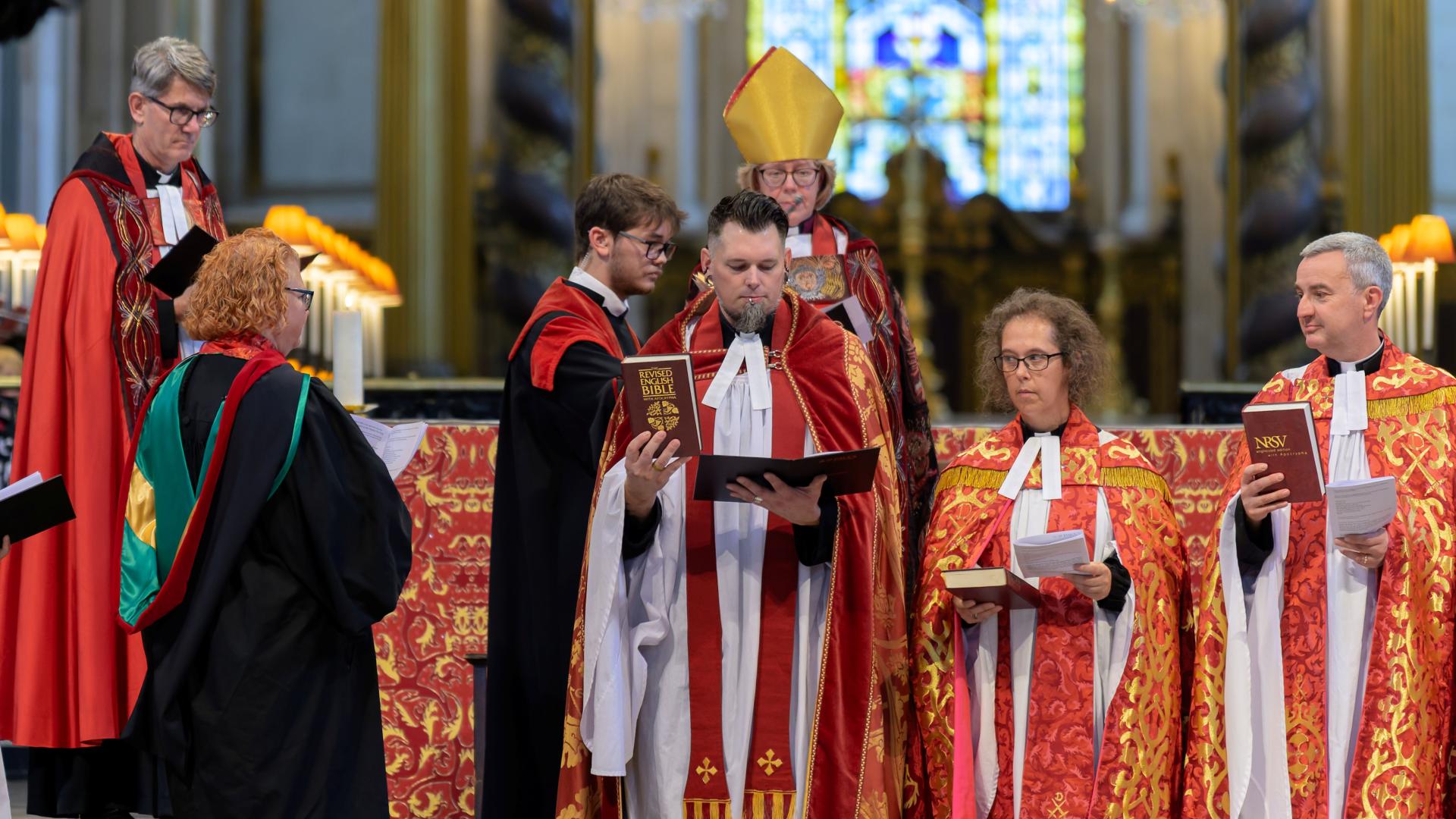 The Revd Timothy Miller stands at the altar during his installation.