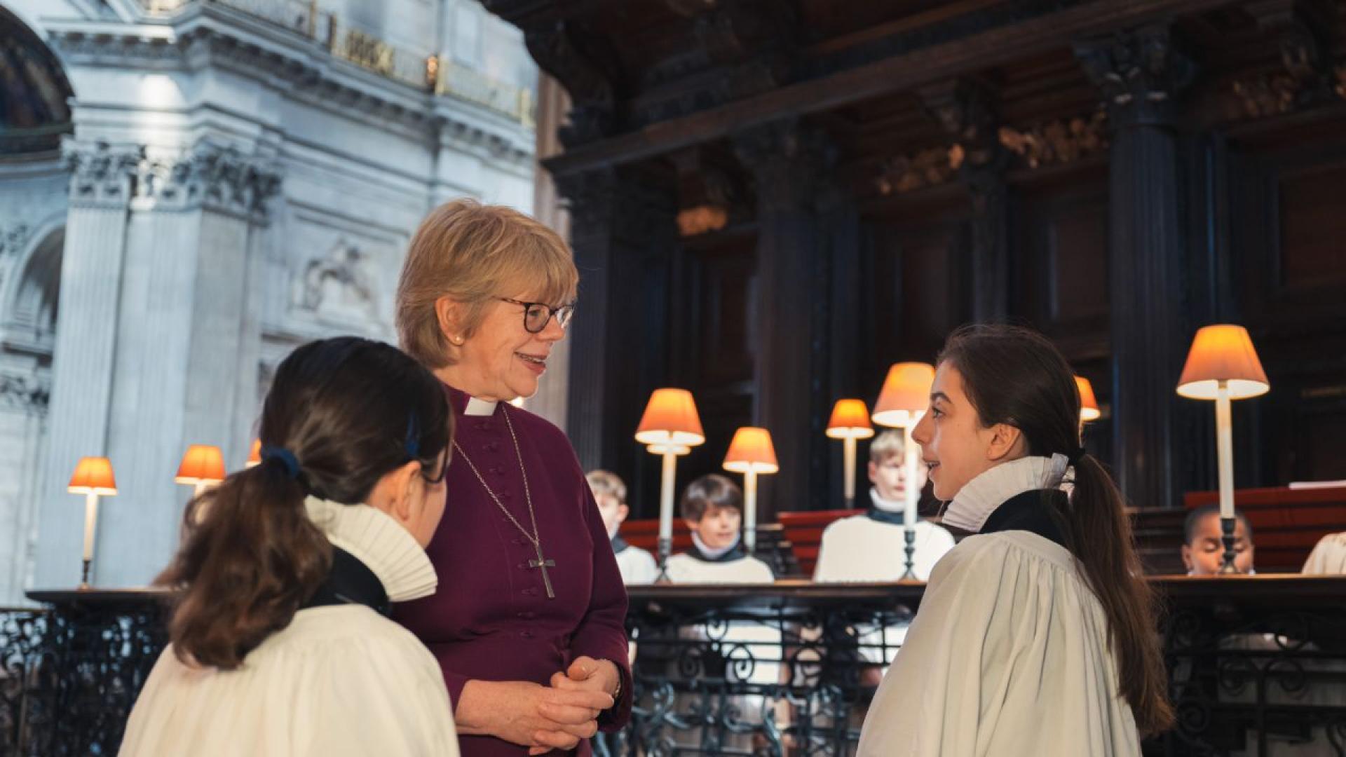 Bishop Sarah, Bishop of London, speaking to two choristers