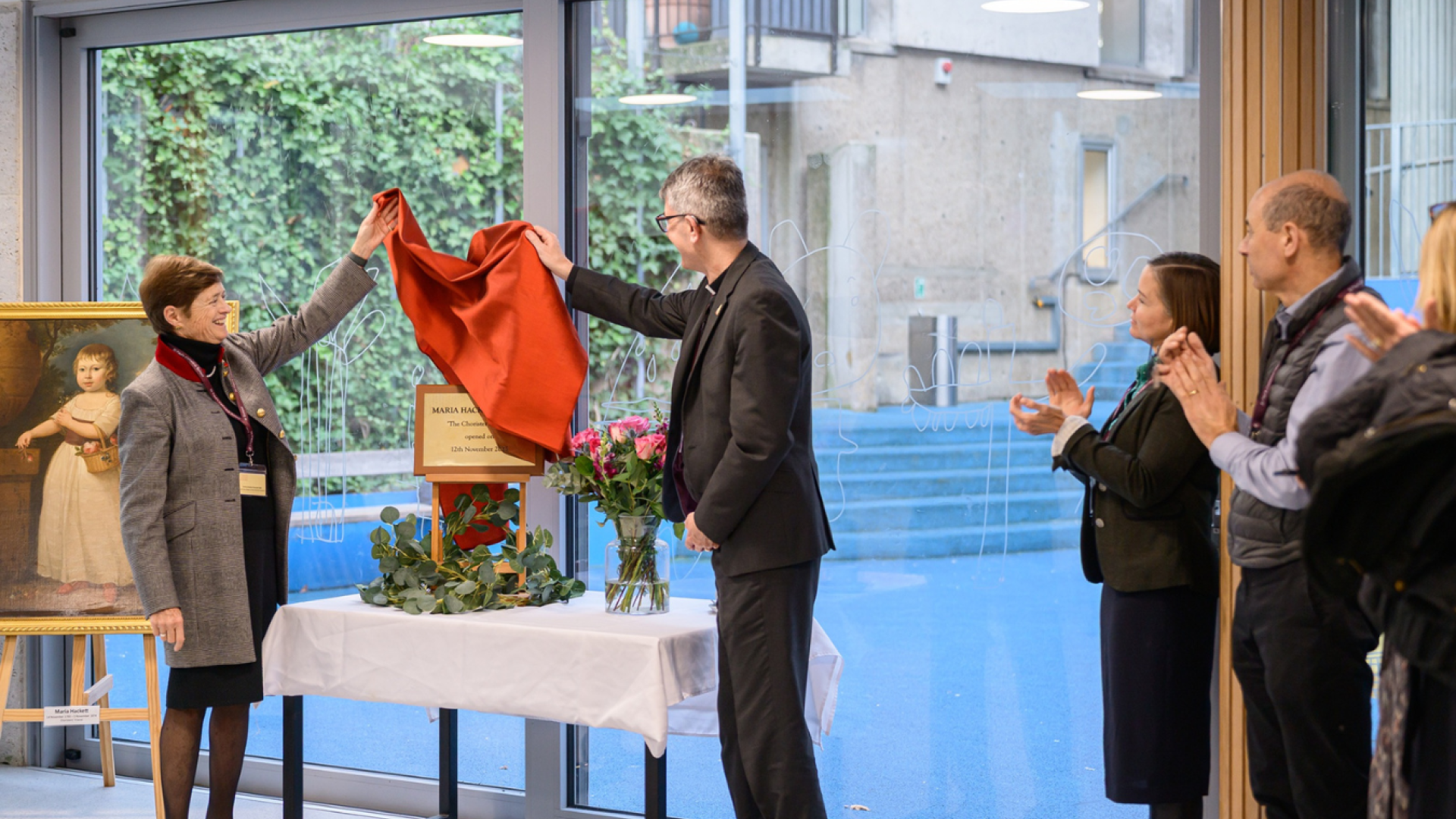 The Dean and the Head of St Paul's Cathedral School unveil the plaque for the new girls' boarding house.