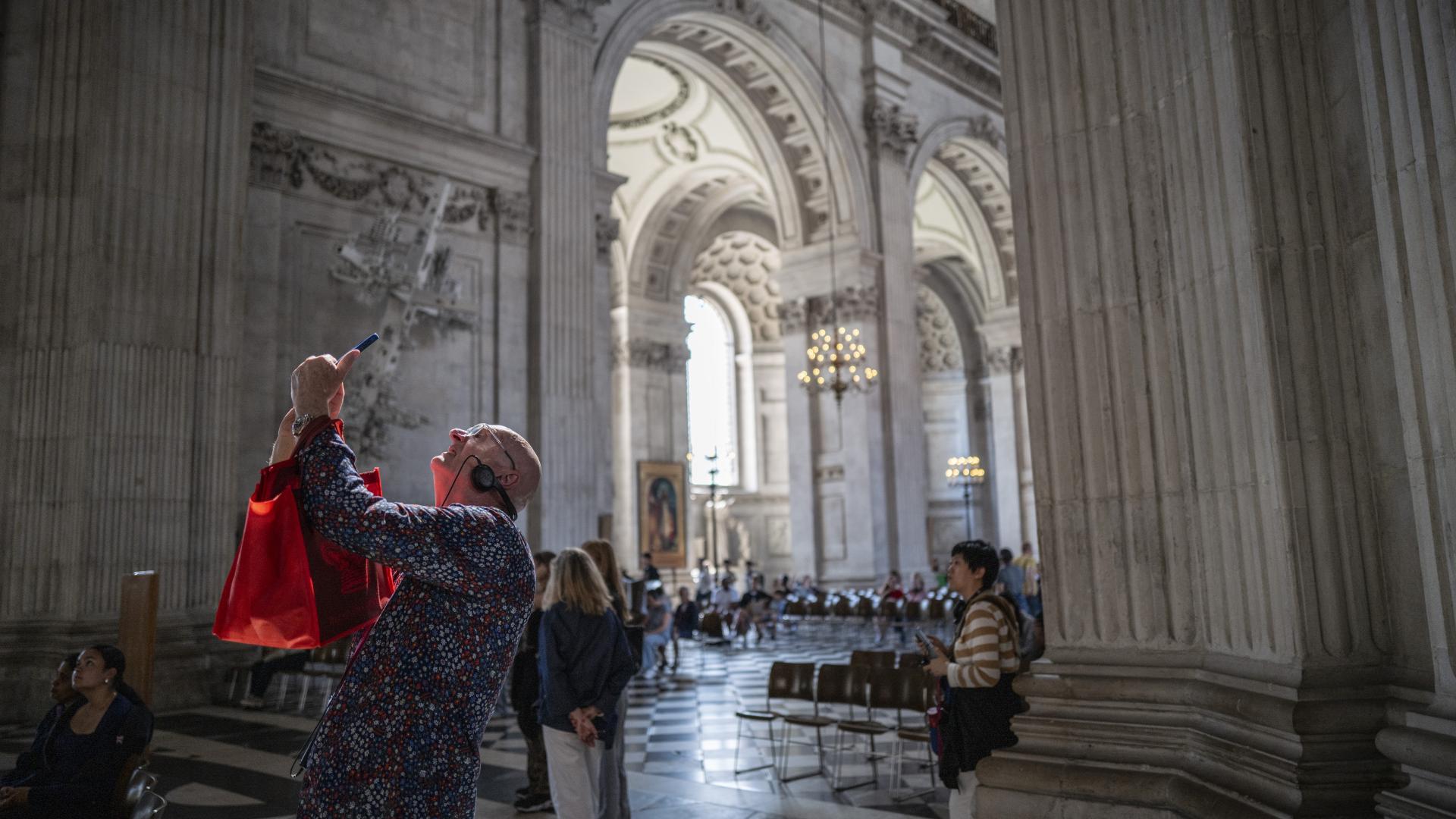 A visitor photographs the Dome.