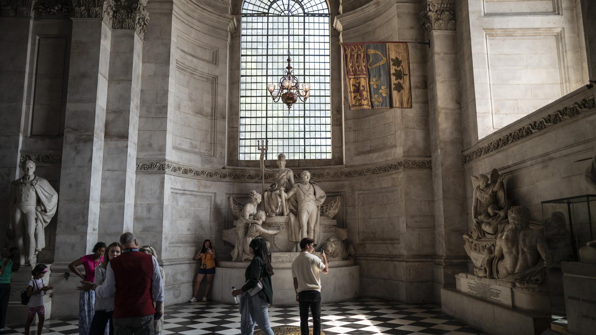Sightseers look at the memorials in the South Transept.
