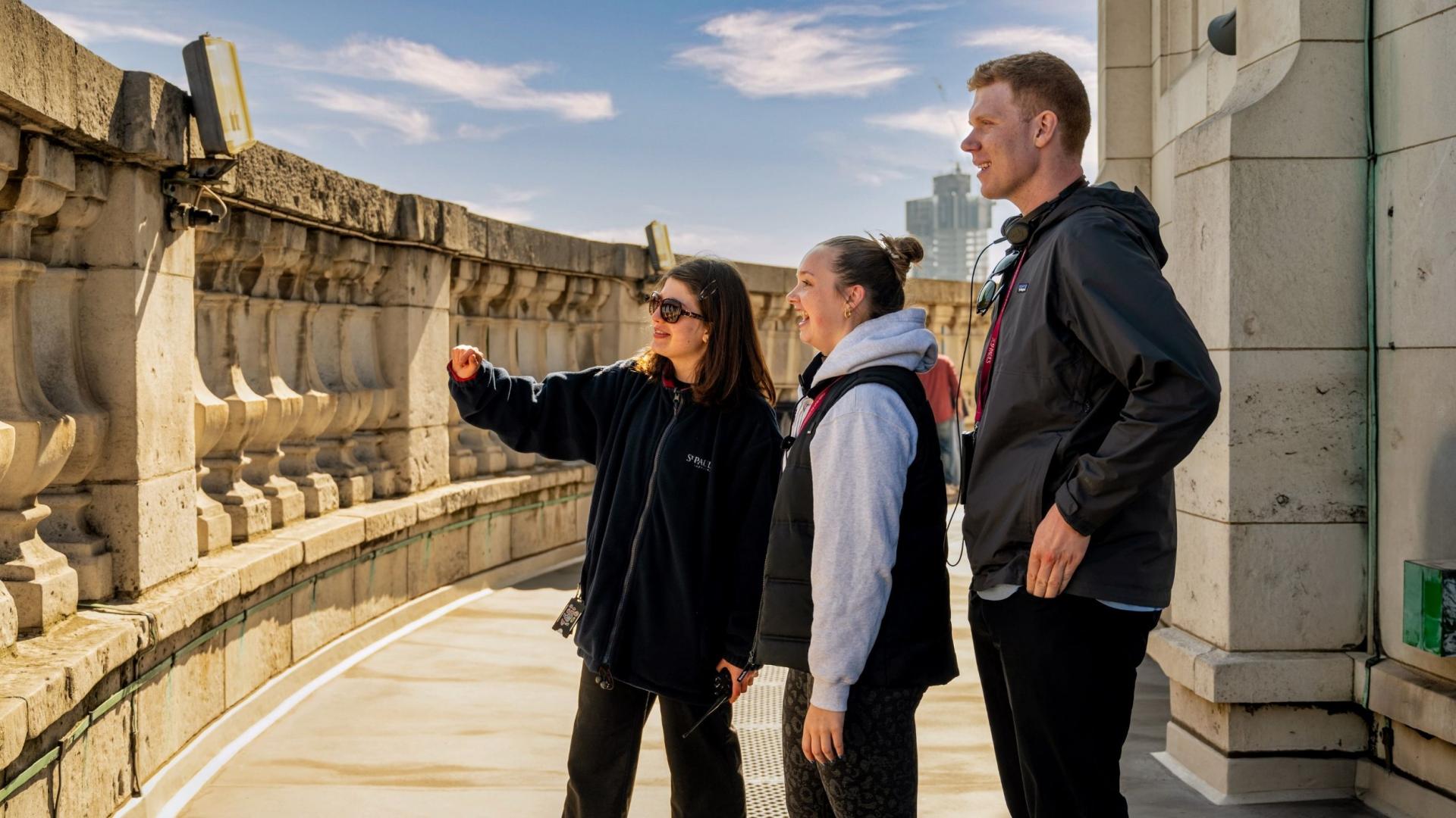 member of staff speaks to visitors