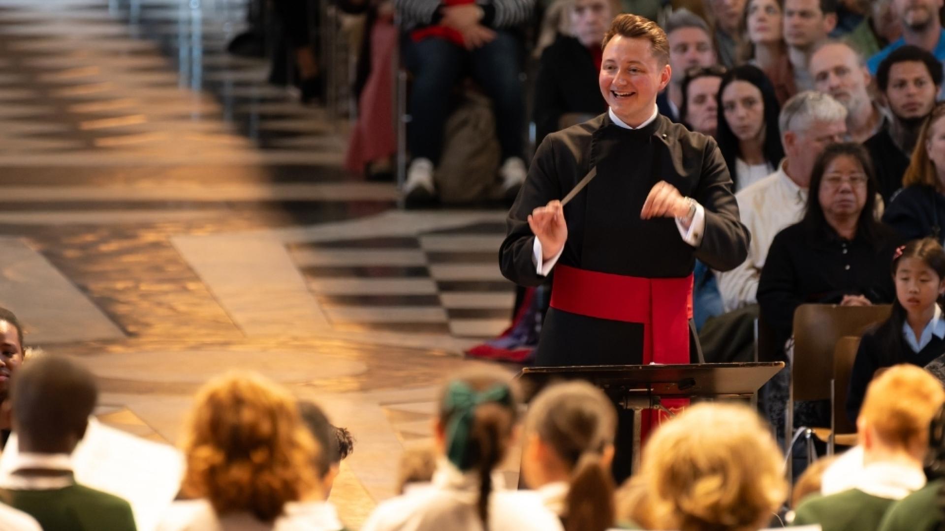 Will Bruce conducts a group of children under the Dome.