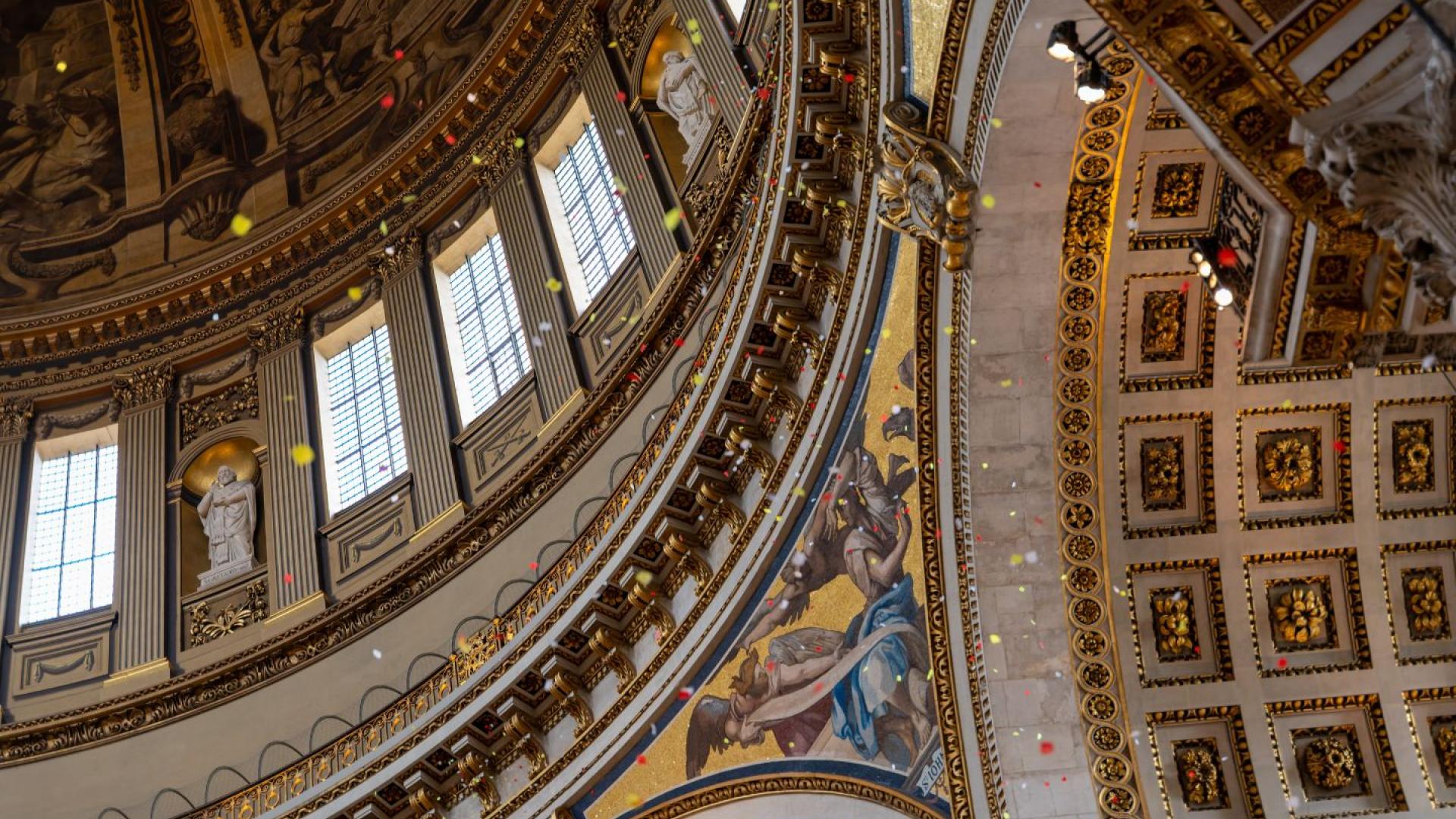 Coloured petals fall from the Whispering Gallery and float to the floor
