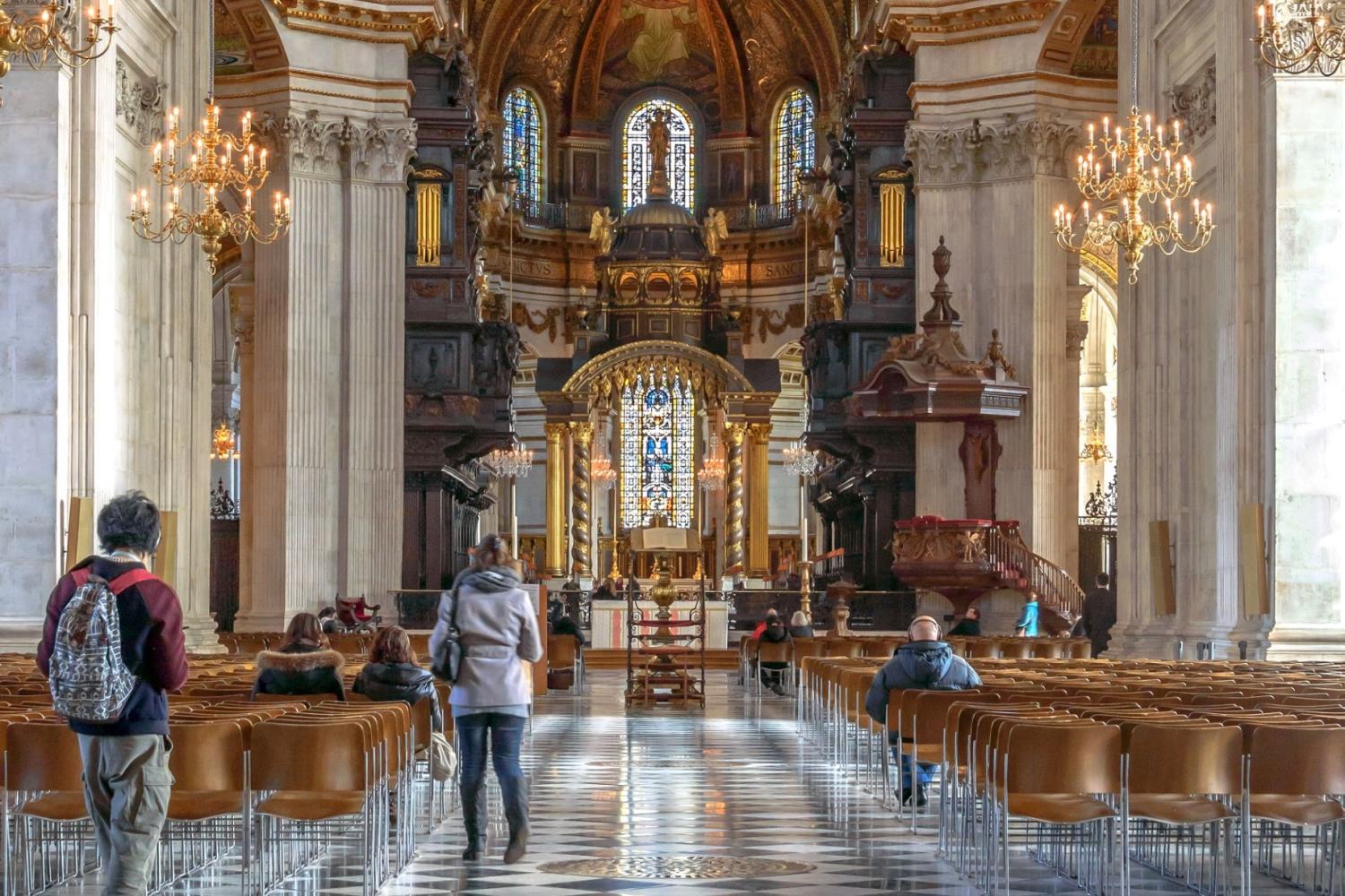the nave with visitors and bright sunlight