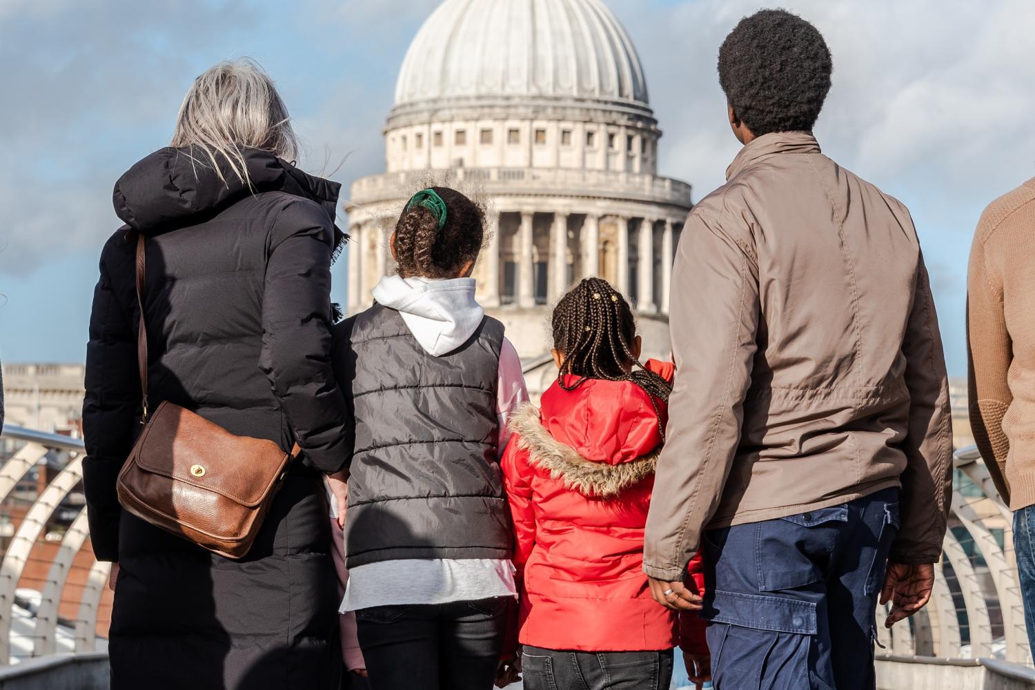 family looking at the dome from the millenium bridge