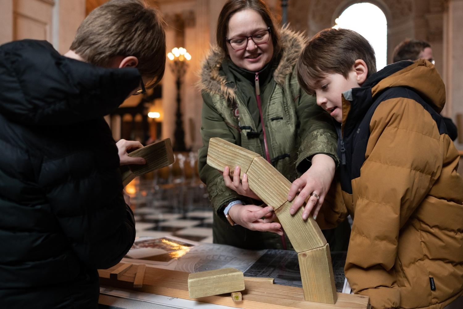young family working on bridge activity