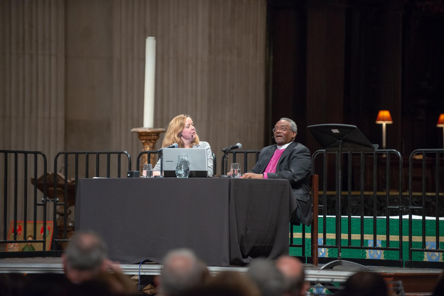 Paula Gooder and Bishop Michael Curry talk to each other on stage at St Paul's Cathedral