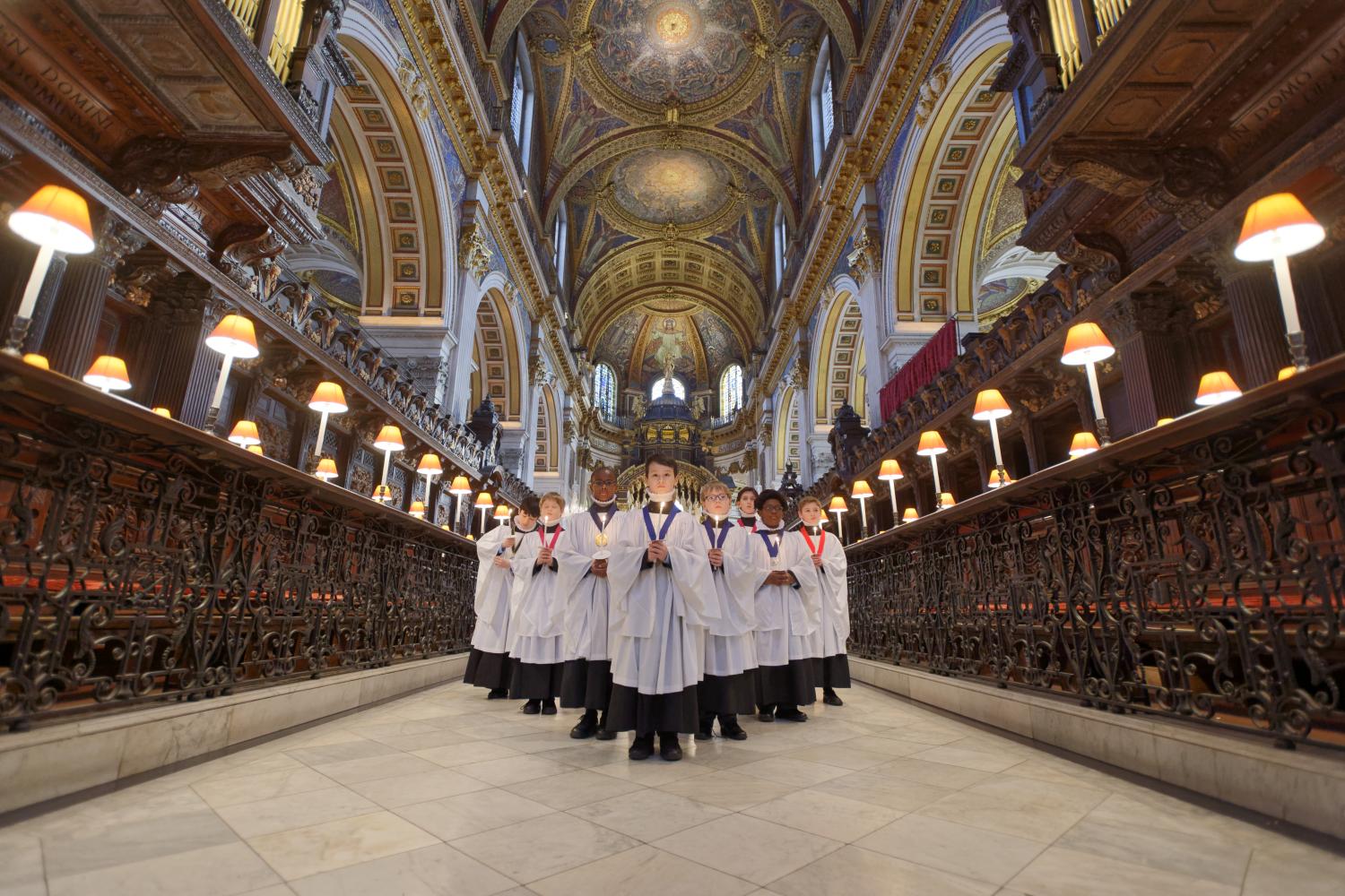 Choristers stand in the Quire at Christmastime