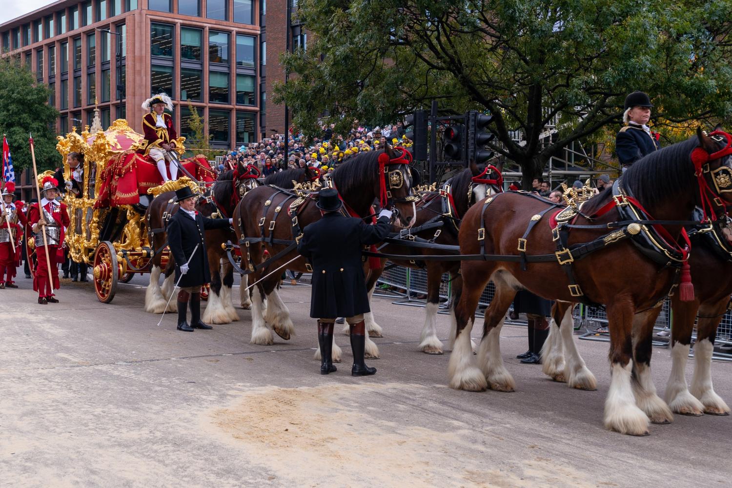 The procession for the Lord Mayor's Show with horses pulling a large golden carriage