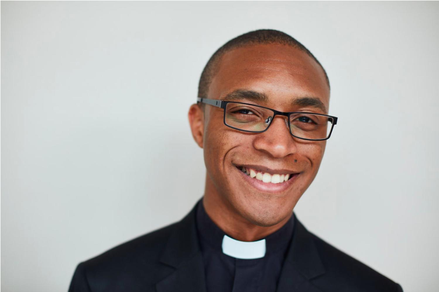 A head and shoulders shot of Jarel smiling to the camera