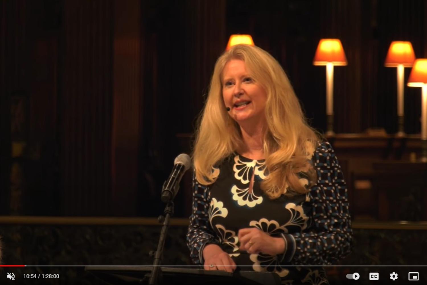 Helen Bond is a white woman with long blond hair and is talking in St Paul's Cathedral