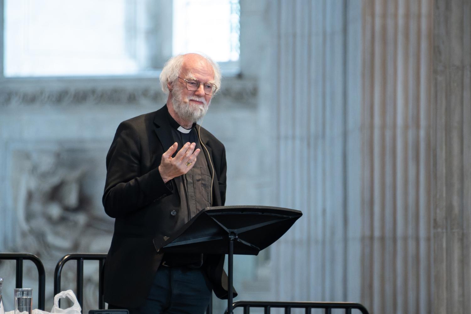 Rowan Williams stands at a lectern in St Paul's Cathedral