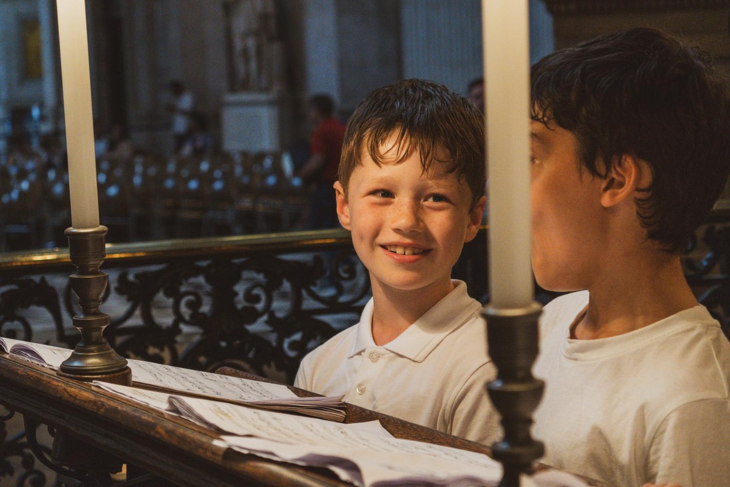 Boy smiling in the choir stalls