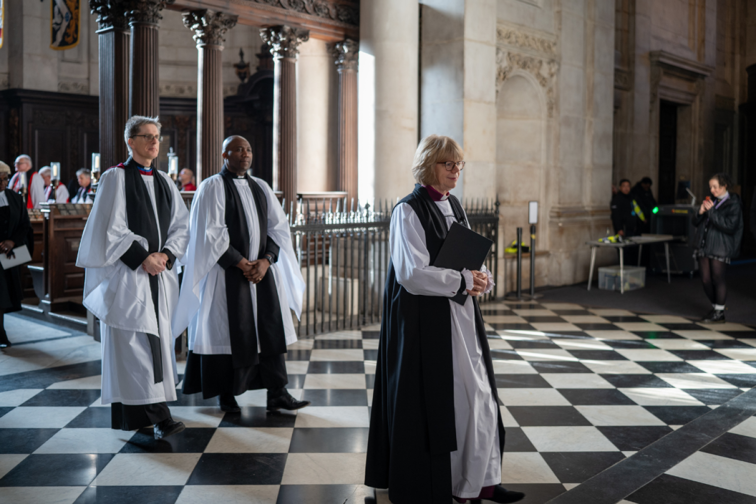 Archbishop Sarah processes followed by two bishops.