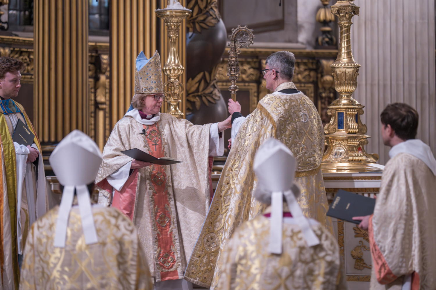Bishop Sarah hands her crozier back to the Dean.