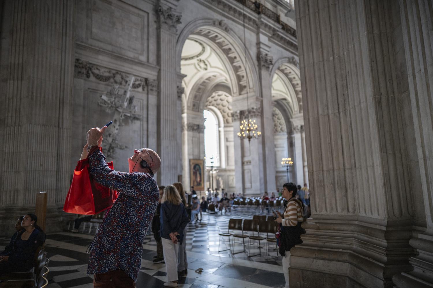 A visitor photographs the Dome.