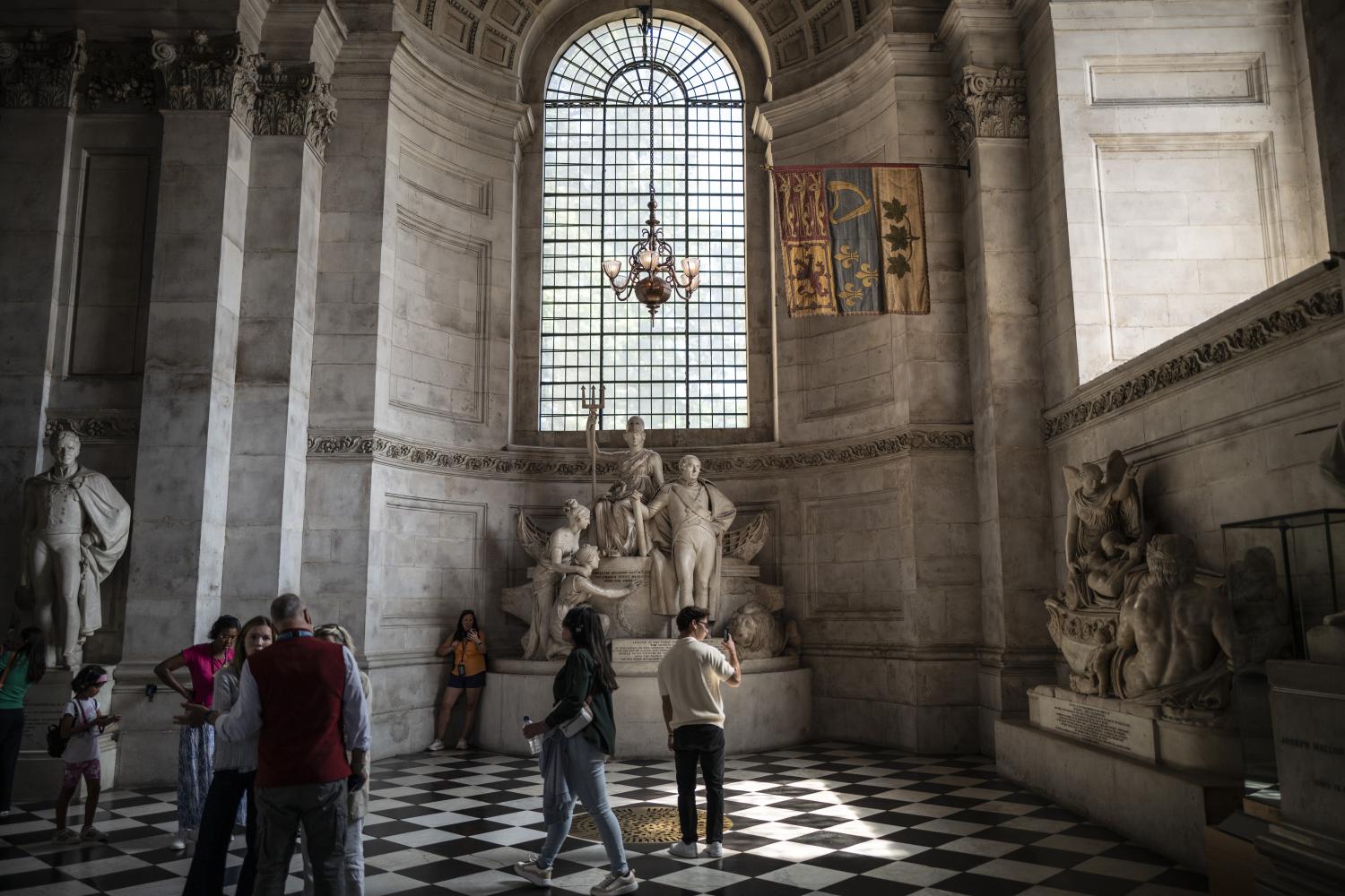 Sightseers look at the memorials in the South Transept.