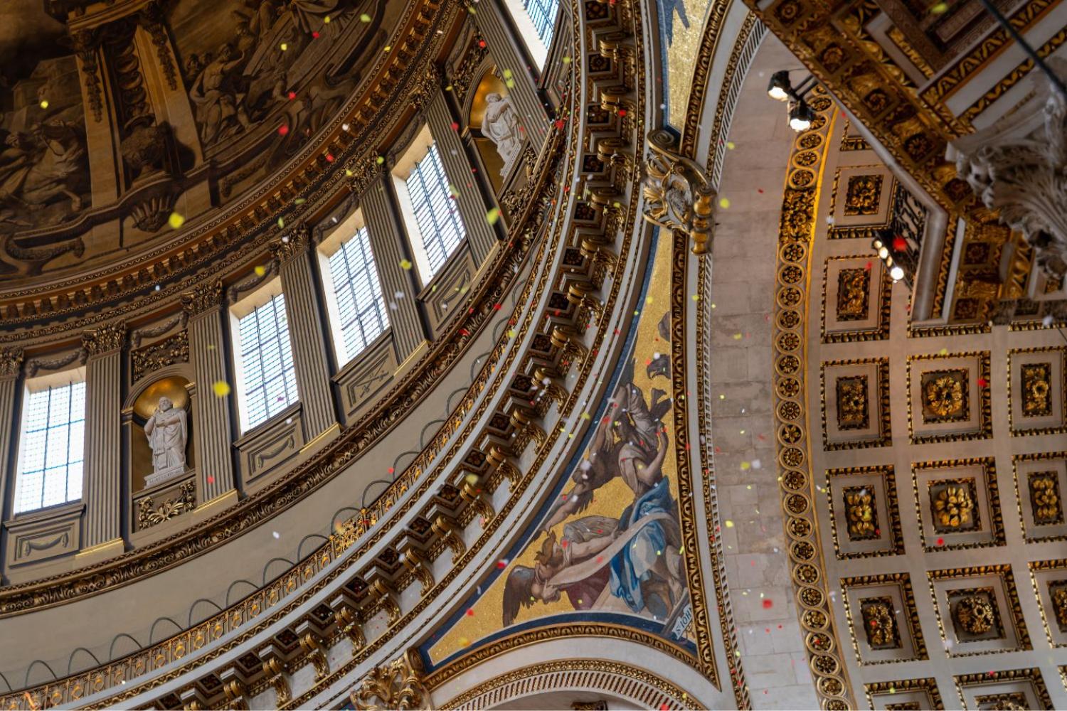Coloured petals fall from the Whispering Gallery and float to the floor