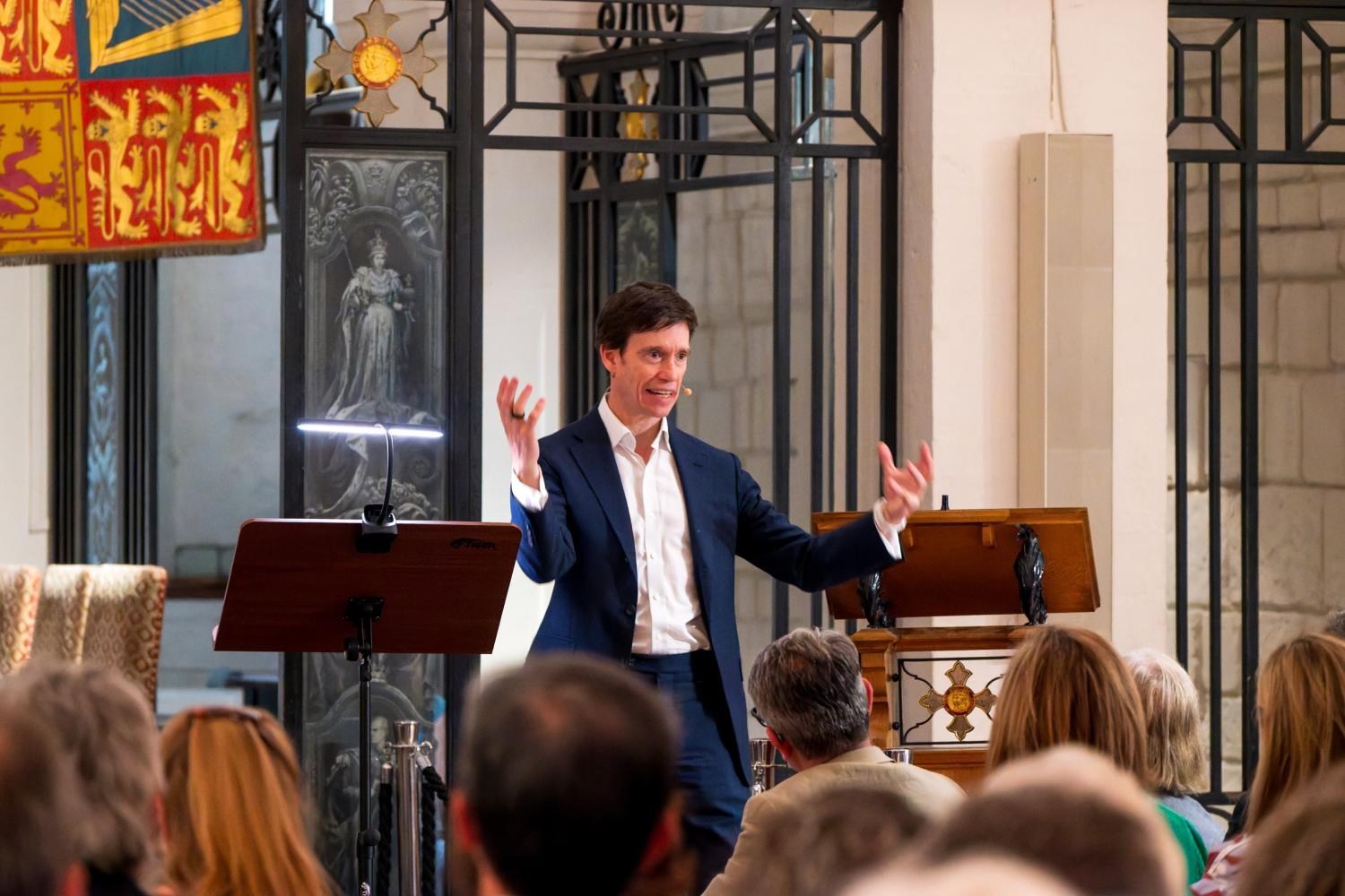 Rory Stewart stands by a lectern in the OBE Chapel in the Crypt of St Paul's Cathedral