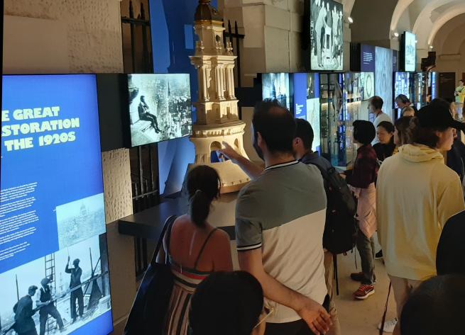 People viewing the Great Restoration exhibition in the Crypt