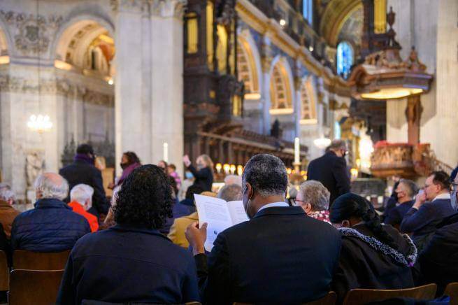 couple reading service schedule during consecration service